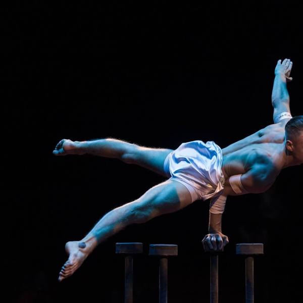 a man jumping in the air doing a trick on a skateboard
