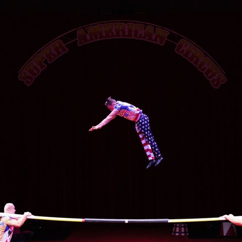 a girl swinging on a stage