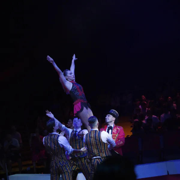 a man standing on a stage in front of a crowd
