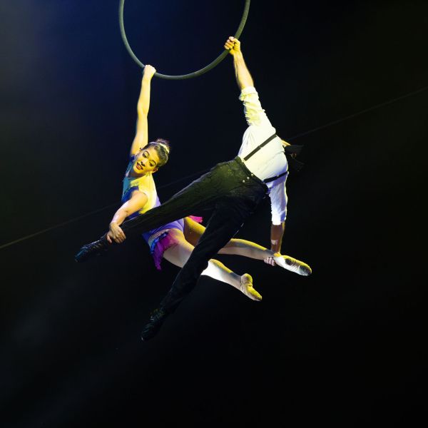 a person jumping up in the dark