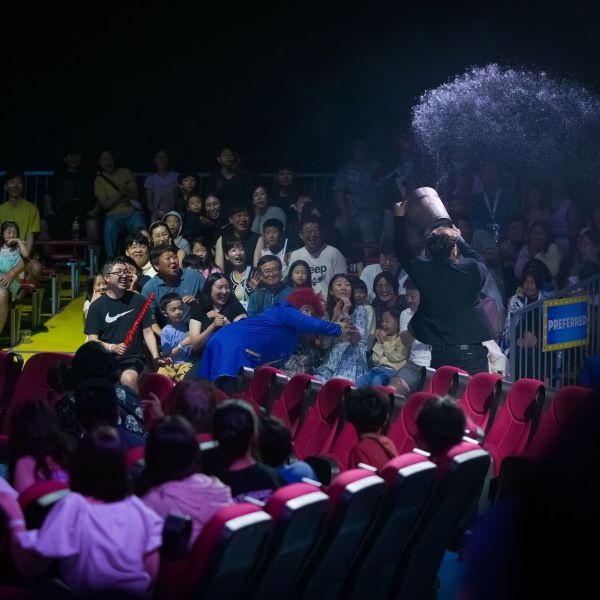 a crowd of people in a dark room