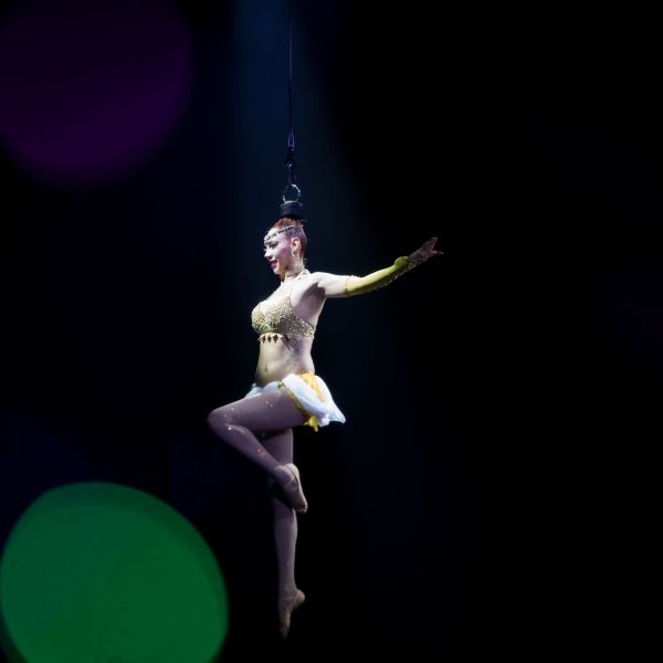a man holding a frisbee in the dark